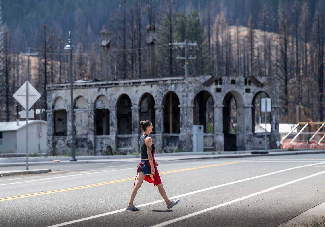 Christi Hazleton, owner of Region Burger, returns to her food truck after making a delivery on Thursday in downtown Greenville. A year after the Dixie Fire, many buildings have been cleared and others wait to be rebuilt.