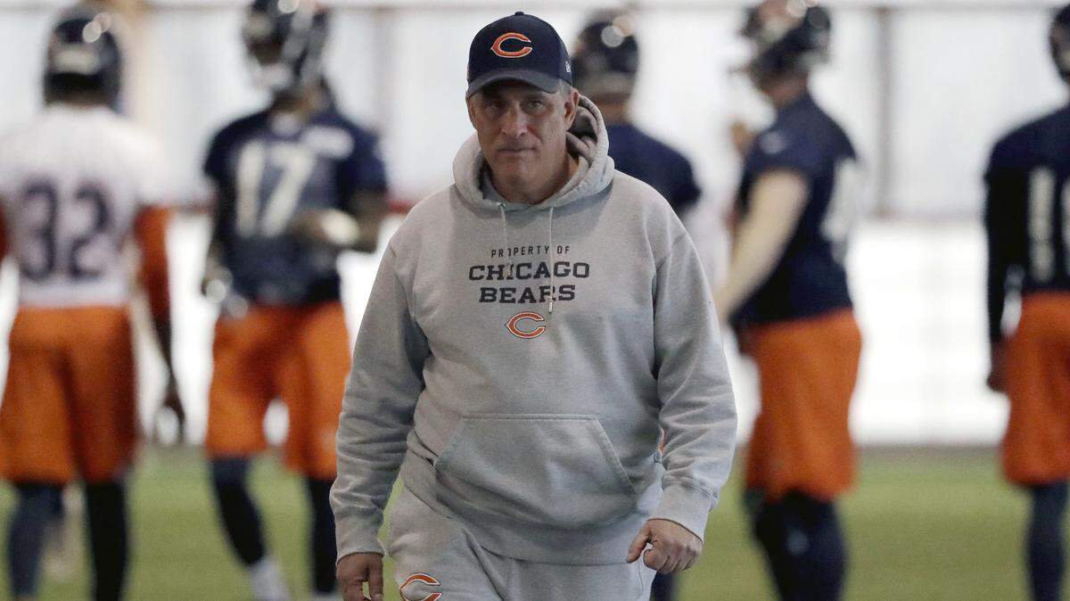 FILE - In this April 18, 2018, file photo, Chicago Bears defensive coordinator Vic Fangio watches players during the NFL football team’s voluntary veteran minicamp in Lake Forest, Ill. A person with knowledge of the decision tells The Associated Press that Denver Broncos general manager John Elway has decided on Chicago Bears defensive coordinator Vic Fangio as his new head coach. The person spoke on condition of anonymity Wednesday, Jan. 9, 2019, because the team hadn’t announced the hiring.(AP Photo/Nam Y. Huh, File)