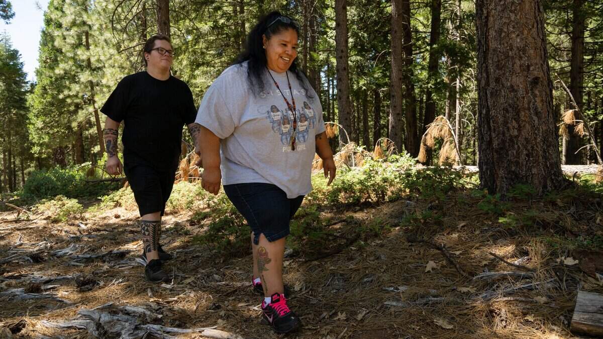 Colfax-Todds Valley Consolidated Tribe chairman Clyde Prout III and his aunt, tribal elder Gerri Camp, 58, walk on the 40 acres that his tribe acquired on Moody Ridge near Alta, Aug. 11, 2022. The California Tribe is located in the Colfax/Placer County area and iincludes the (Nisenan) Maidu & Miwok people of the area. California tribes are receiving nearly $30 million from the state for housing, homeless support and other housing-related initiatives.