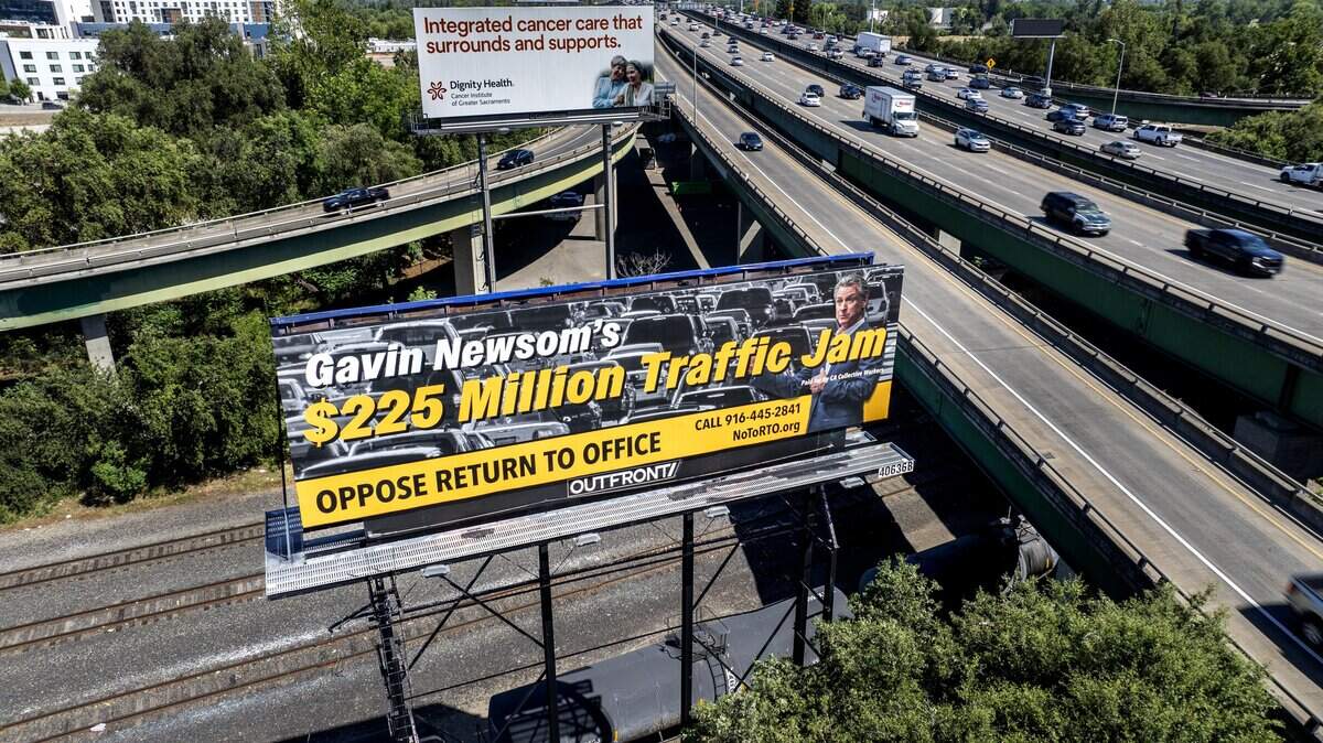 A billboard opposing Gov. Gavin Newsom’s return-to-office order, visible to the eastbound commuters along the Capital City Freeway, is displayed in West Sacramento on Thursday, June 4, 2026. The billboard is the latest effort by state workers against the order.