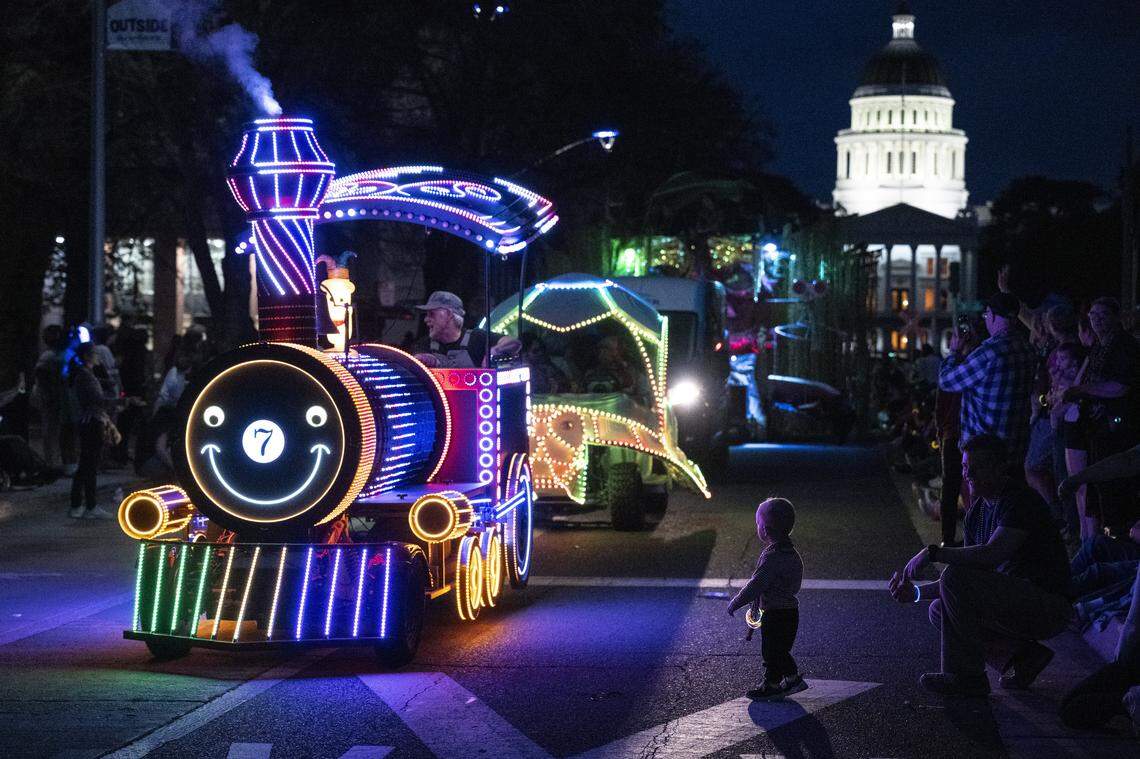 A train decorated with lights is driven down Capitol Mall during the City of Trees Parade in Sacramento on Saturday, Feb. 28, 2026.
