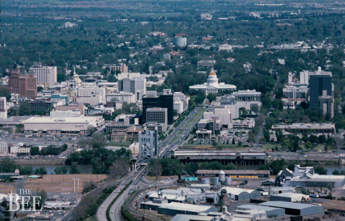 The Tower Bridge sports its original aluminum silver paint scheme in a 1975 aerial image of downtown Sacramento. In 1976, the bridge was repainted a golden color to reflect the state’s gold rush history and to match the hues of Capitol dome. The color of the Capitol dome was later changed to a dark gray.
