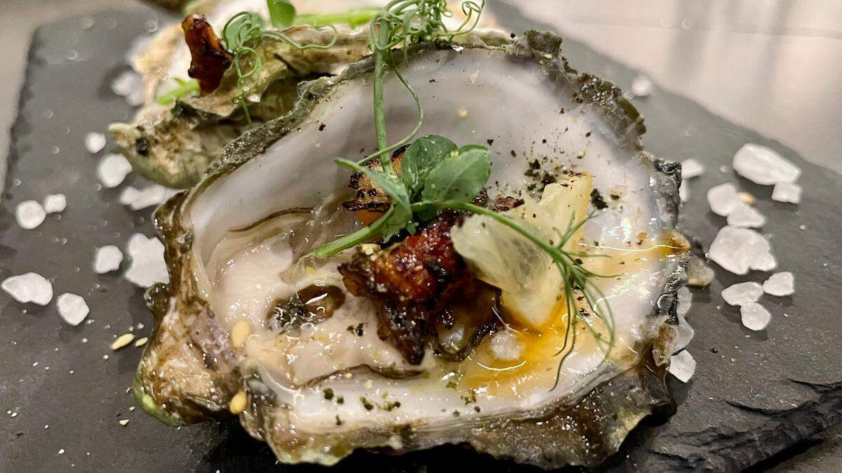 Omakase Por Favor specializes in oysters, such as these ones broiled and served with marinated unagi.