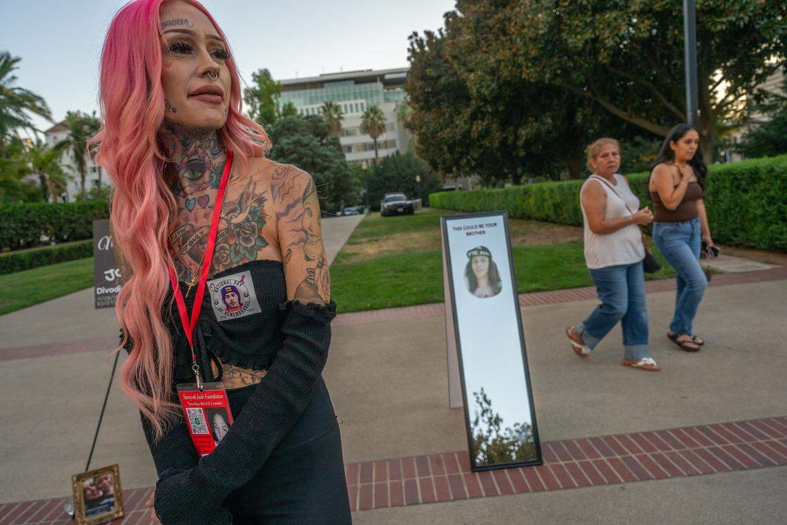 Erika Pringle stands near a mirror with her brother Andrew Pringle’s picture, which reads “This could be your brother,” before giving a tribute for him at a National Day of Remembrance for homicide victims on Sept. 25 at the state Capitol in Sacramento. Pringle said she will host an event there on Sunday for vehicular homicide in memory of her brother, who was killed by a driver who ran a red light.
