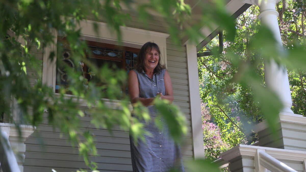 Sacramento resident Lauren Lajoie outside her 112-year-old Capitol Mansions home. Lajoie has a degenerative eye disease which leaves her with five percent of her vision, but said she wanted to live there based on the feeling she had when entering the home.