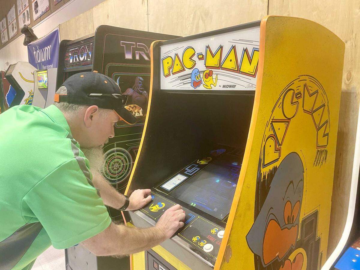 Fox Hamilton focuses on Pac-Man while competing in the Arcade Game Gauntlet on Monday. Hamilton was the winner of the tournament.