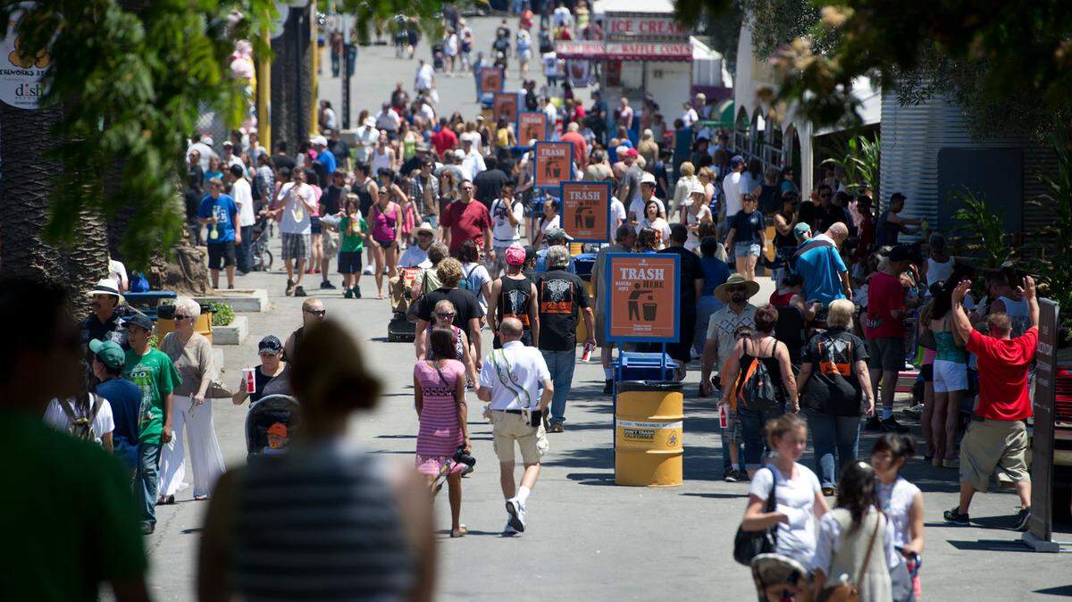 Fairgoers walk the grounds at Cal Expo in 2011. As the fair prepares to open for the first time during the pandemic, fair officials say they are prepared to have a safe festival this year.
