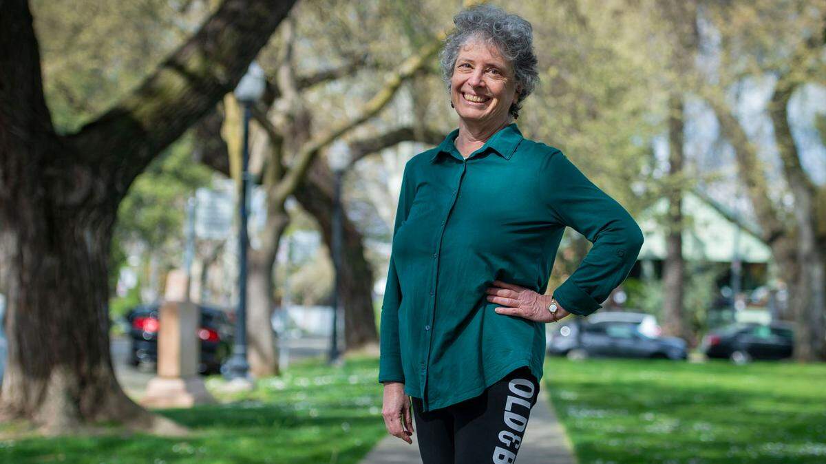 Laurie Litman, 69, co-chair of the Sacramento chapter of Third Act, stands at Ulysses S. Grant Park on Sunday, March 13, 2022, in midtown Sacramento. Litman, with a background in biology, has a concern for climate change and hopes Third Act, an activism organization for people over 60 years old, can make a change for the better.