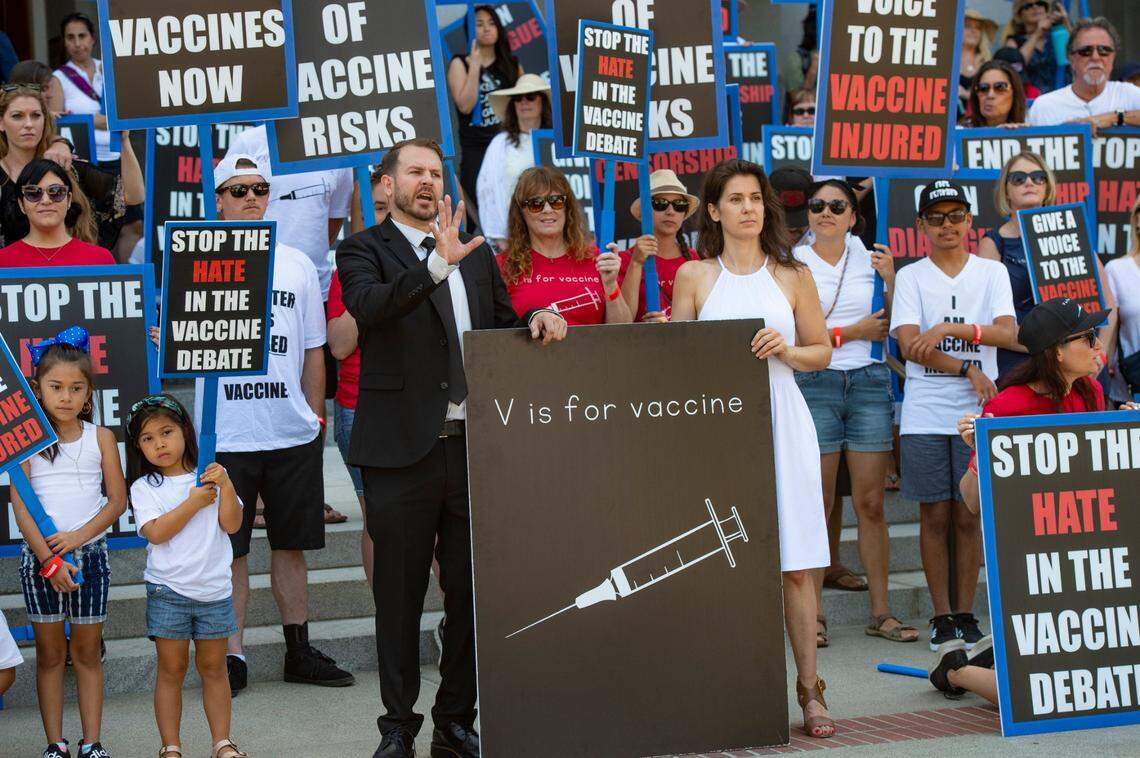 Anti-vaccine activist Joshua Coleman speaks to the crowd at a protest at the state Capitol on June 23.