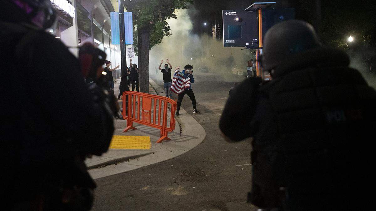 Sacramento Police fire tear gas to disperse demonstrators 10th Streets during a protest over the death of George Floyd on Sunday, May 31, 2020 in Sacramento during the coronavirus pandemic. Floyd was murdered by Minneapolis police officers while being detained, which prompted protests throughout the country.