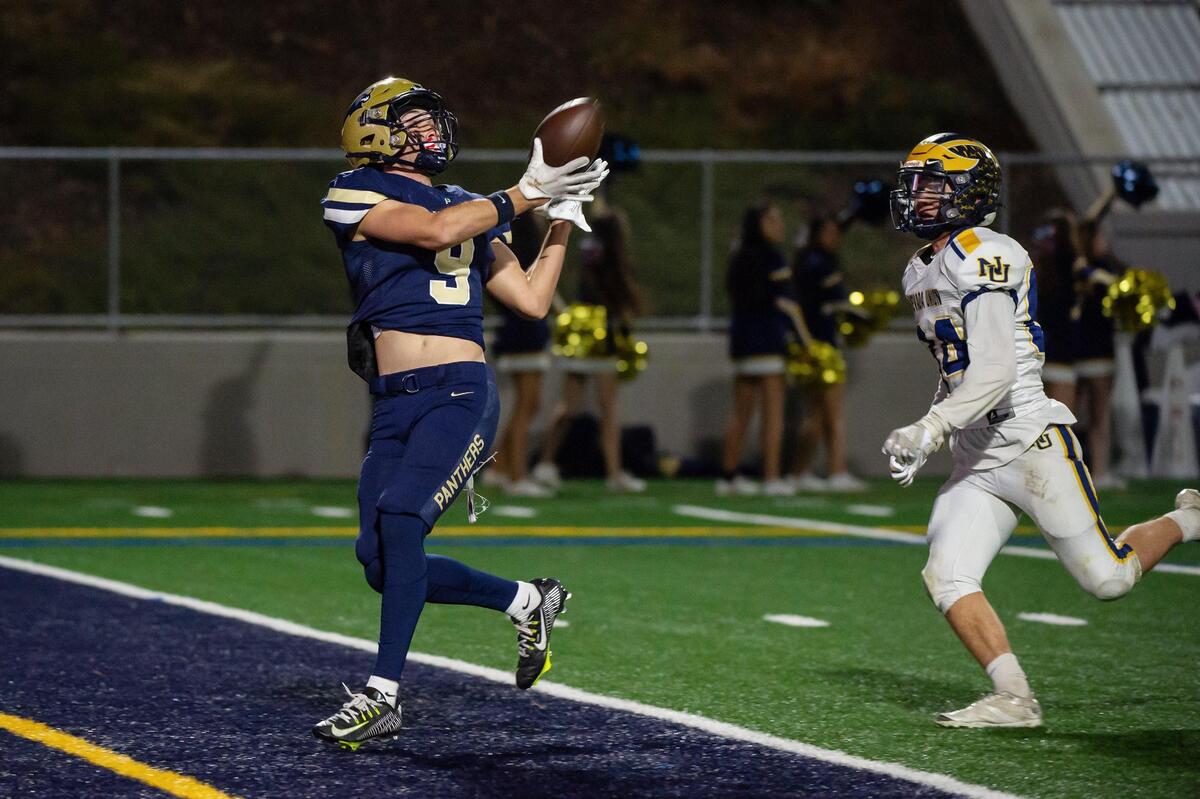 West Park Panthers Ryan Sisson (9) catches a 37-yard pass in front of Nevada Union Miners Dylan Lampe (84) for a touchdown during the first quarter in the CIF Sac-Joaquin division IV quarterfinals playoff game Friday at West Park High School in Roseville.