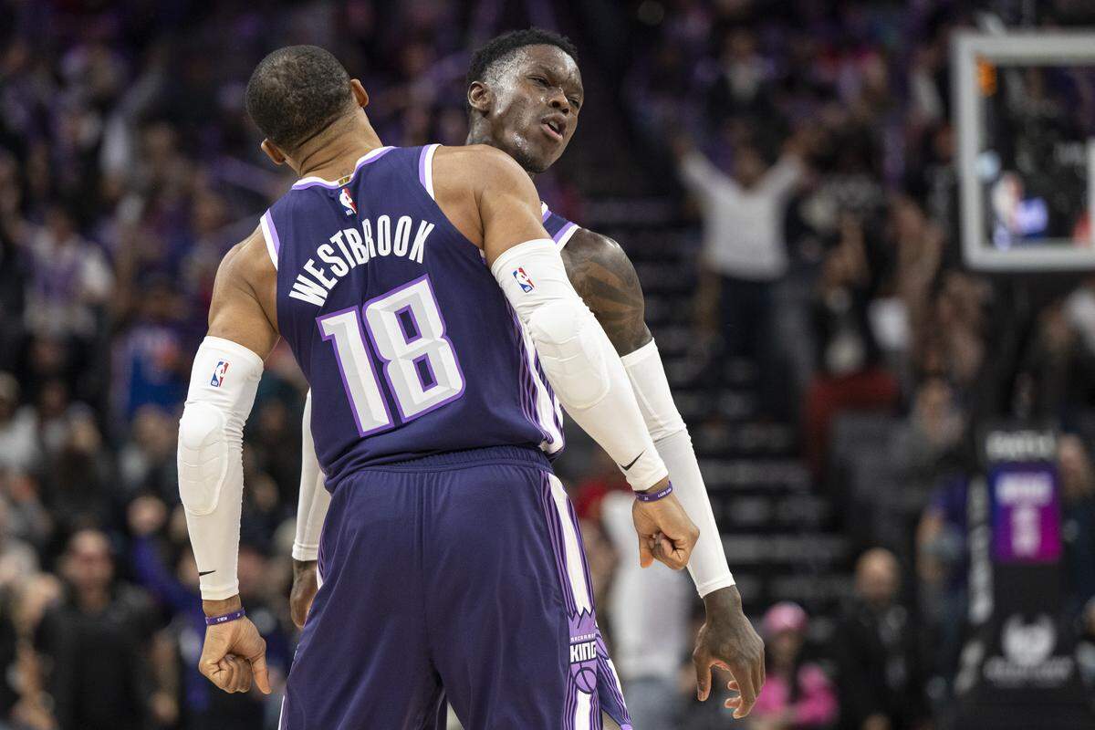 The Sacramento Kings’ Dennis Schroder and Russell Westbrook (18) chest bump after Westbrook scored against the Houston Rockets at Golden 1 Center on Sunday.