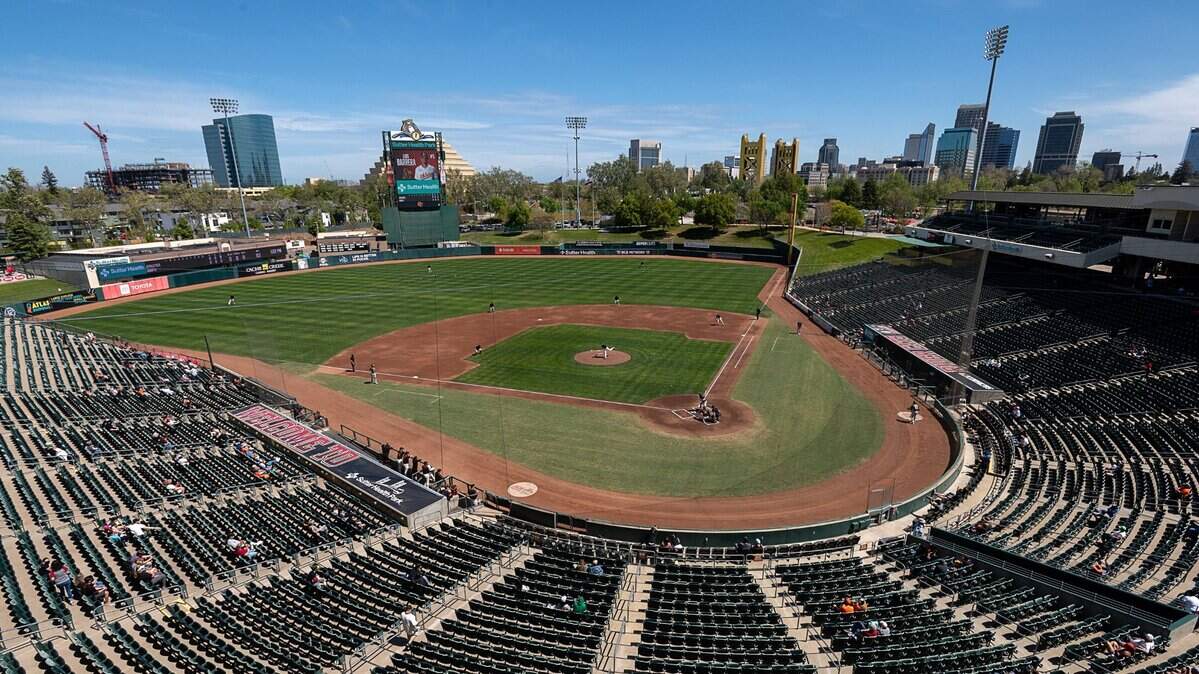 Baseball fans sit apart as they watch the first scrimmage between the San Francisco Giants and Oakland A’s alternate site teams at Sutter Health Park in West Sacramento on Wednesday, April 7, 2021. Fans will be able to attend seven more scrimmages the park, with tickets on sale now, with outdoor sports events open to fans in Yolo County as coronavirus restrictions ease. The River Cats regular season begins May 6, with their home opener on May 20.