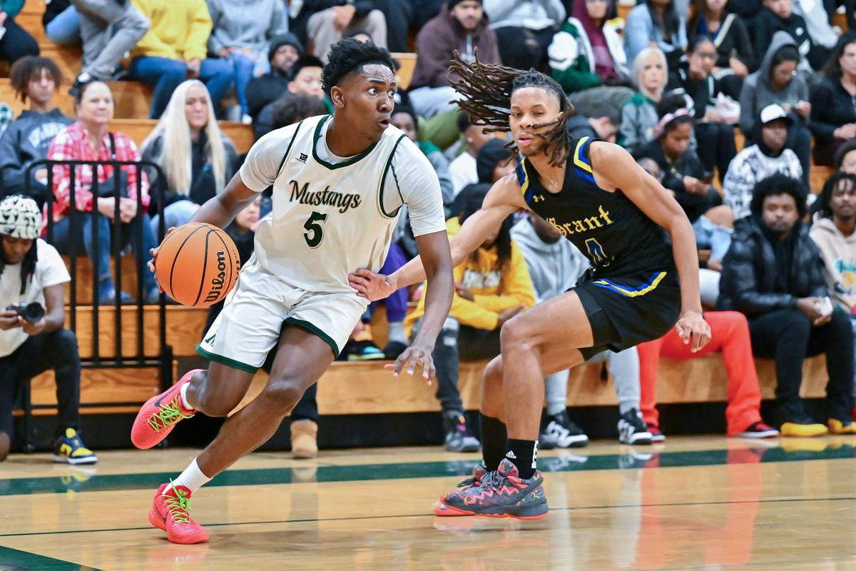Monterey Trail Mustangs guard Brandon Gibson Jr (5) drives to the basket around the Grant Pacers’ Isaiah Montue (4) during the second half of a game on Jan. 10, 2024, at Monterey Trail High School in Elk Grove.