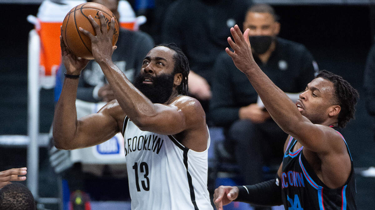 Brooklyn Nets guard James Harden (13) drives to basket past Sacramento Kings guard Buddy Hield (24) in the second quarter during a game at Golden 1 Center on Monday, Feb. 15, 2021 in Sacramento.