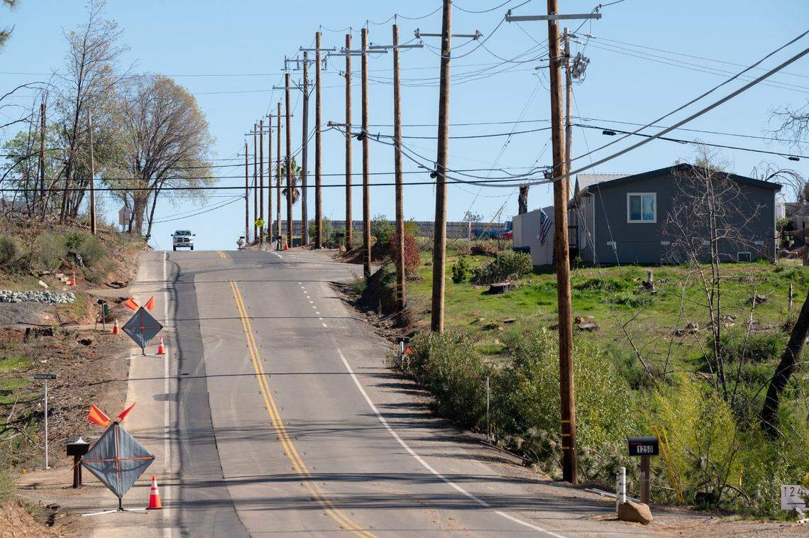 Newly installed underground power lines are covered by new asphalt on Pearson Road in Paradise in February. By 2025, overhead wires will disappear for good in Paradise and a portion of nearby Magalia, said PG&E spokesman Paul Moreno.