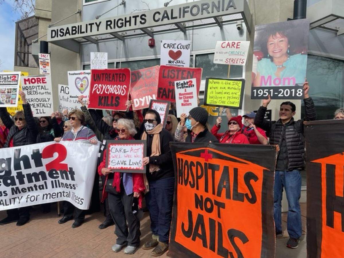 Family members of seriously mentally ill Californians rally outside the K Street office of Disability Rights America on Tuesday, February 14, 2023.