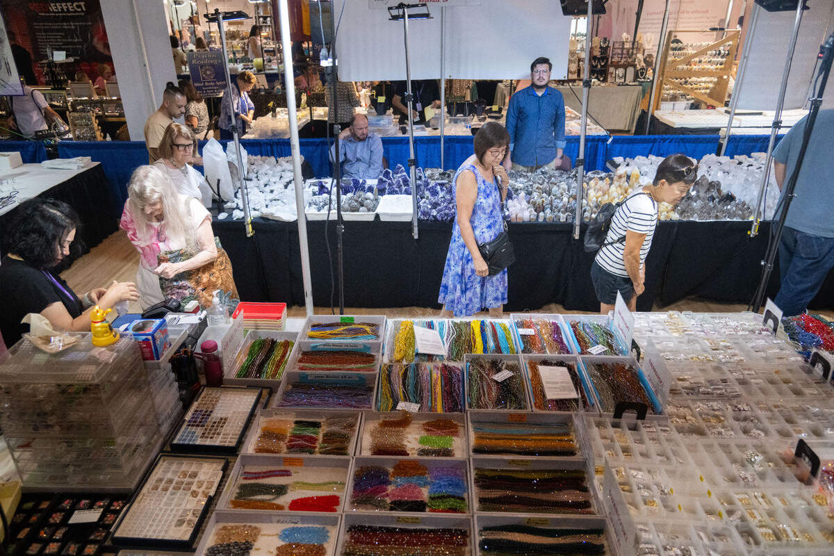 Visitors peruse booths during the Gem Faire at the Scottish Rite Masonic Center in Sacramento on Friday, Aug. 2, 2024. “It is amazing what you can see from the inventory and the items that come from around the world,” said Gem Faire manager Allen Van Volkinburgh.
