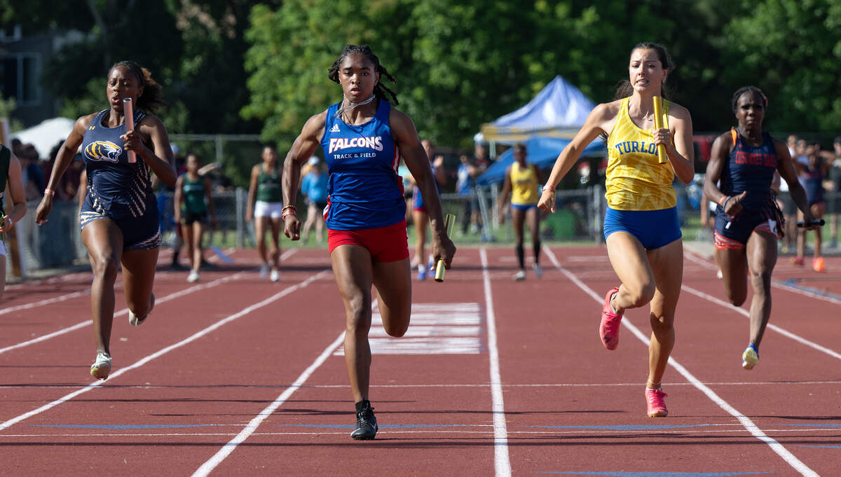 Christian Brothers anchor runner Sydnie Watkins, middle, edges out Turlock’s Shaylan Roy-Williams, right, in the girls 4x100 meter race at the CIF Sac-Joaquin Section Masters Track Championship at Davis High School in Davis, Calif., Saturday, May 18, 2024. Christian Brothers won with a time of 47.33 and Turlock was second at 47.66, Inderkum placed 3rd at 47.91.