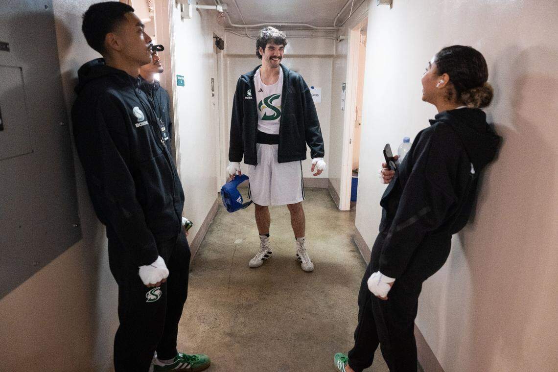 Sacramento State boxers Neal Fumar, Austin Melendez and Ayahna Gonzales wait for their fights to begin at the Causeway Boxing Classic at Memorial Auditorium on Friday.