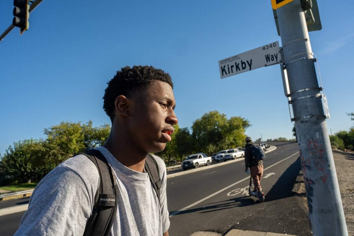 Jahison Tracy, then a junior at Creative Connections Arts Academy, talks about the dangers of walking on Walerga Road in North Highlands on Oct. 22, 2024. Many students walk, bike and ride scooters along the path, which he says makes it even more dangerous along traffic. “It feels very unsafe and very stupid to have this walk here right next to a high school,” he said. “I don’t know how that went through.”