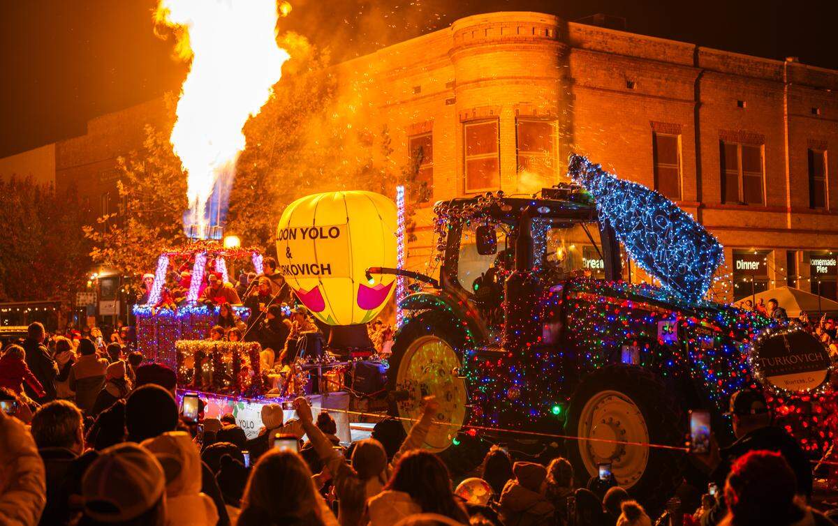 The burners ignite above the basket of a hot air balloon-themed float by Balloon Yolo in the Winters Tractor Parade on Dec. 6.