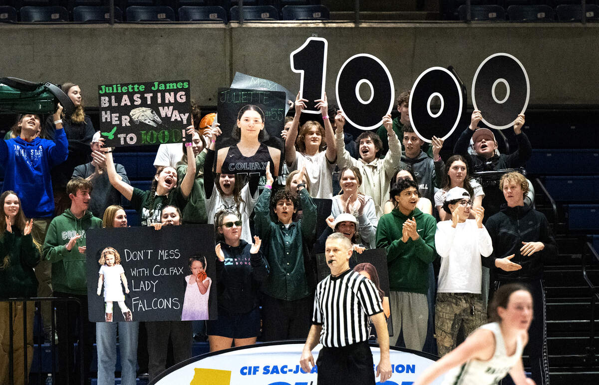 Colfax students celebrate Juliette James’ record of 1,000 career points during the Sac-Joaquin Section Division IV championship game against Escalon at UC Davis on Friday. James scored a game-high 18 points, and grabbed 17 rebounds.