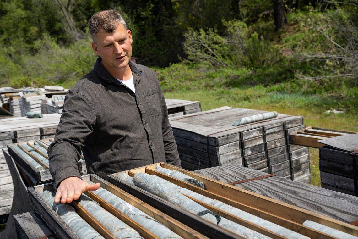 Rise Gold Corporation CEO Ben Mossman gestures in May towards some of the exploratory drilling samples – ones without gold&nbsp;– his company has taken in recent years at the historic Idaho-Maryland Mine near Grass Valley. The company says it has found gold near the mine’s existing tunnels.