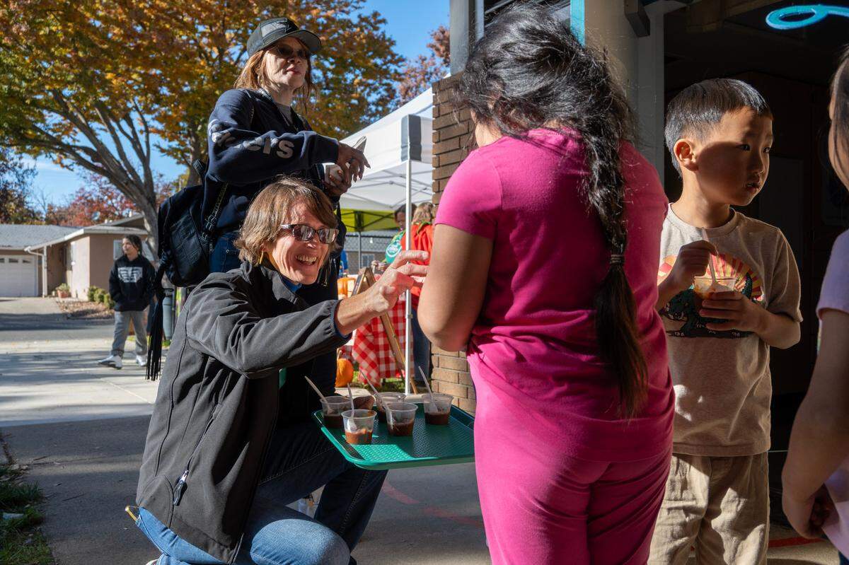 Amber Stott, Food Literacy Center Kitchen founder, passes out pumpkin chili samples to children at John Sloat Elementary School on Dec. 1.