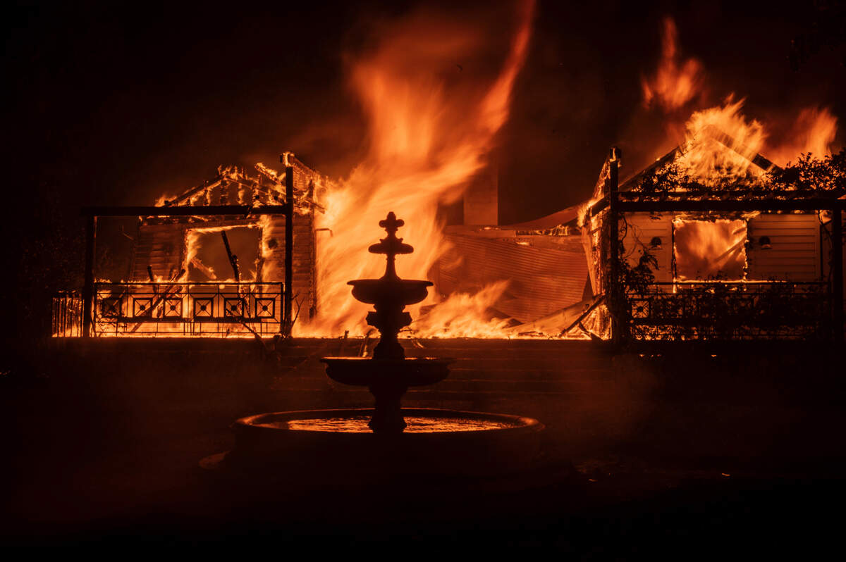 An outbuilding related to the Glass Mountain Inn goes up in flames as the Glass Fire burns along the Silverado Trail near St. Helena in the Napa Valley on Sunday night.