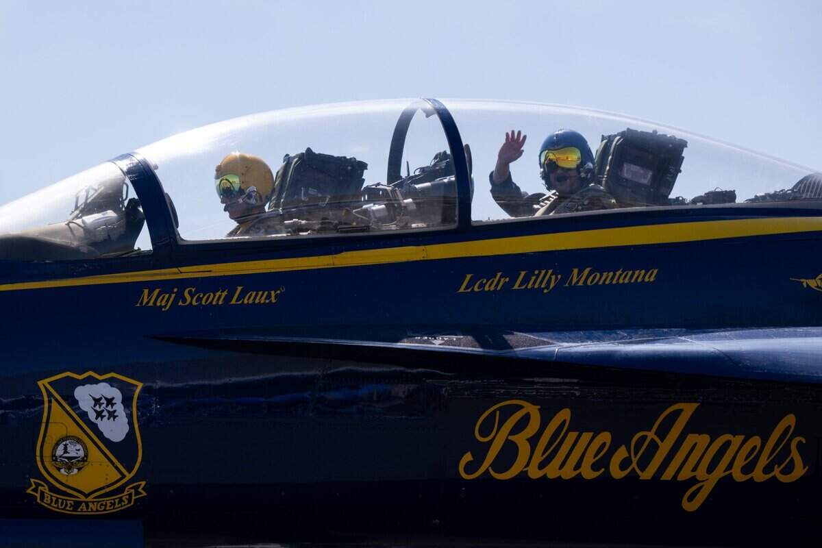 Mills Middle School teacher Jason McKnight and Blue Angels pilot Maj. Scott Laux take a 45-minute flight at Mather Airport on Tuesday.