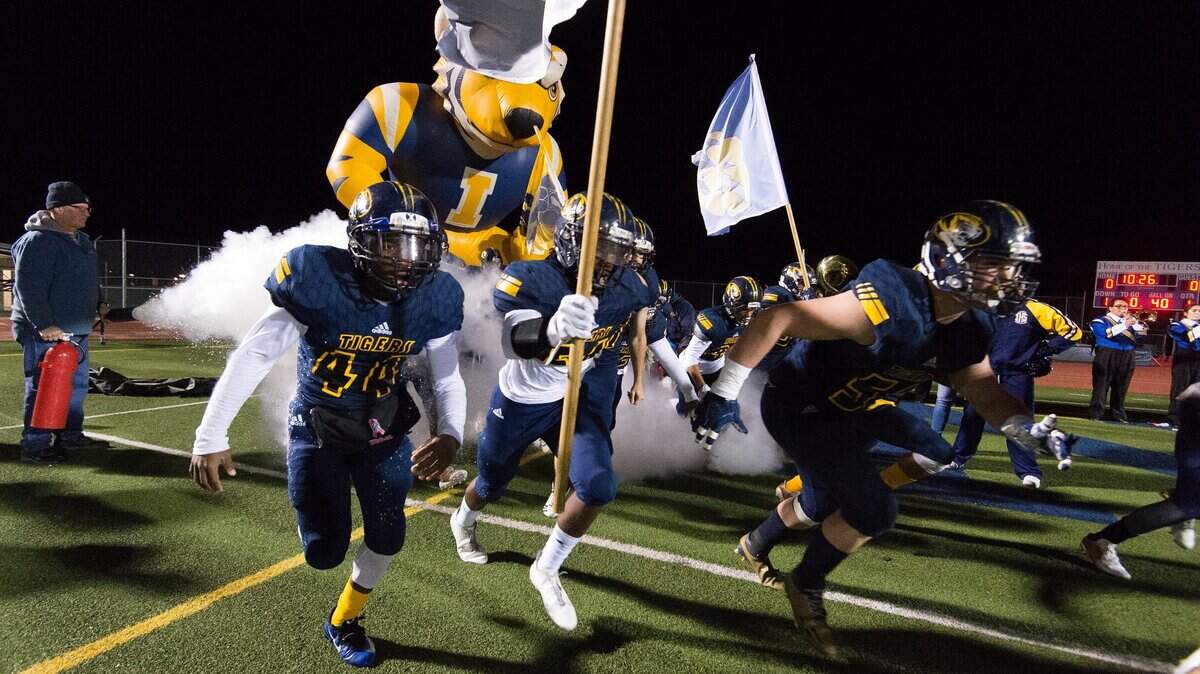 Inderkum players race to the field to face Del Oro in a Sac-Joaquin Section Division II playoff game last season. The section plans to announce Wednesday whether to allow this week’s playoff games to go on as scheduled or postpone them due to air quality concerns resulting from the Camp Fire.
