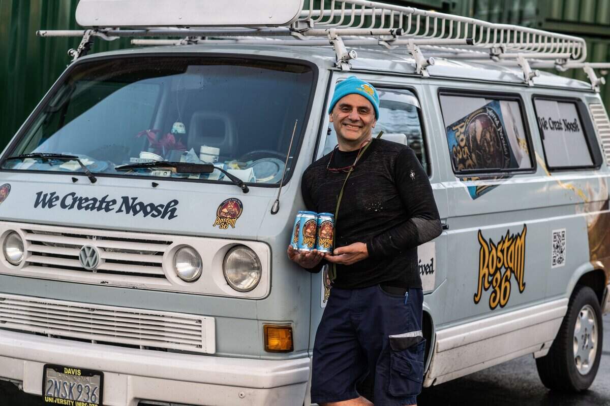 Karan Khoshcar, a Persian American beer maker from Davis, stands on Friday, Jan. 3, 2024, next to the VW van that he drives around the state to distribute his Rostam 36 pilsner.