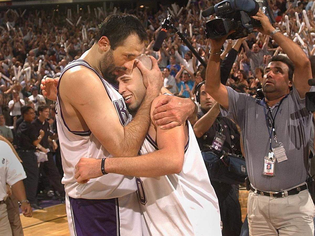Vlade Divac gives NBA Western Conference Finals Game 5 hero Mike Bibby a hug at the conclusion of game between the Sacramento Kings and the Los Angeles Lakers at Arco Arena, Tuesday, May 28, 2002.