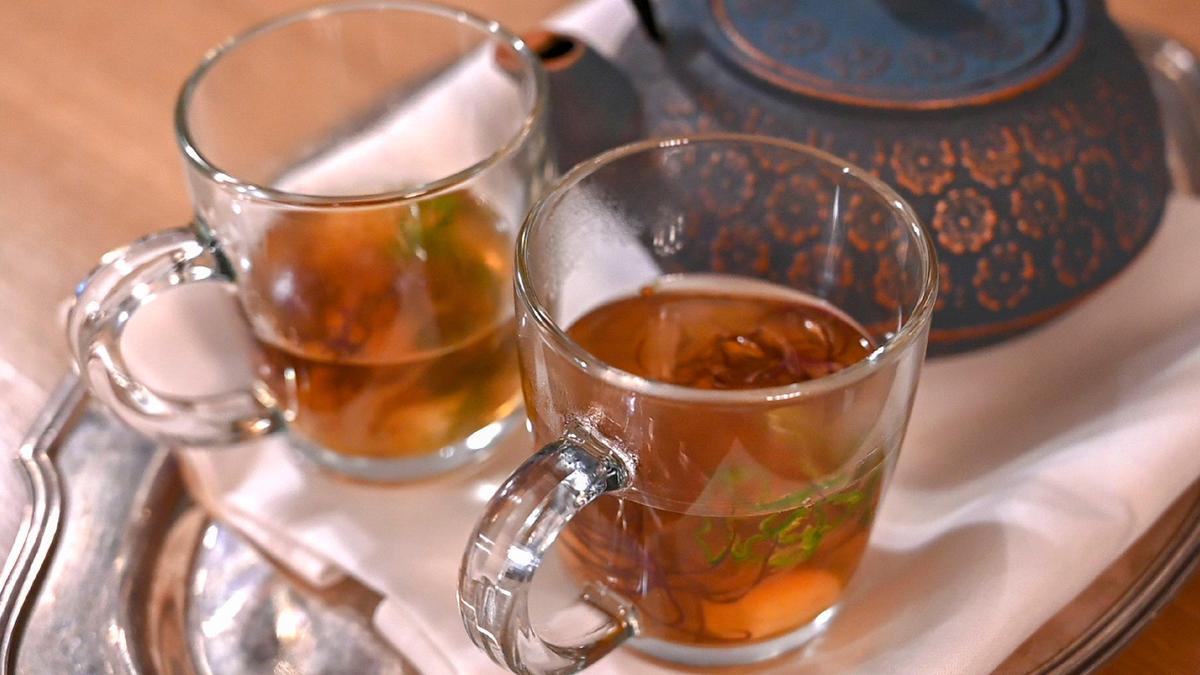 Tamarind Consomme over Coconut Dumplings costs $12 at Canon and is served on a silver platter,