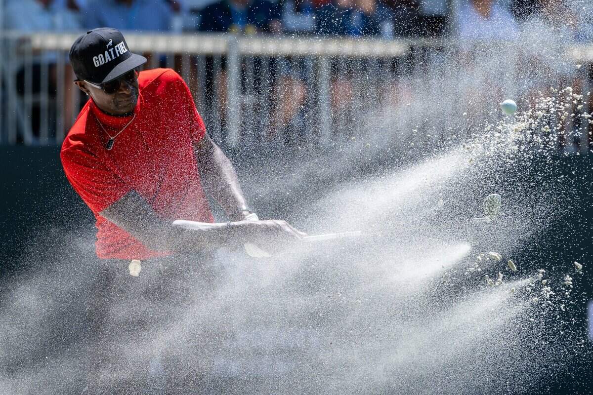NFL Hall of Famer Jerry Rice hits out of sand trap on the 17th hole during the American Century Championship celebrity golf tournament at Edgewood Tahoe Resort in Stateline, Nev., on Friday, July 11, 2025.