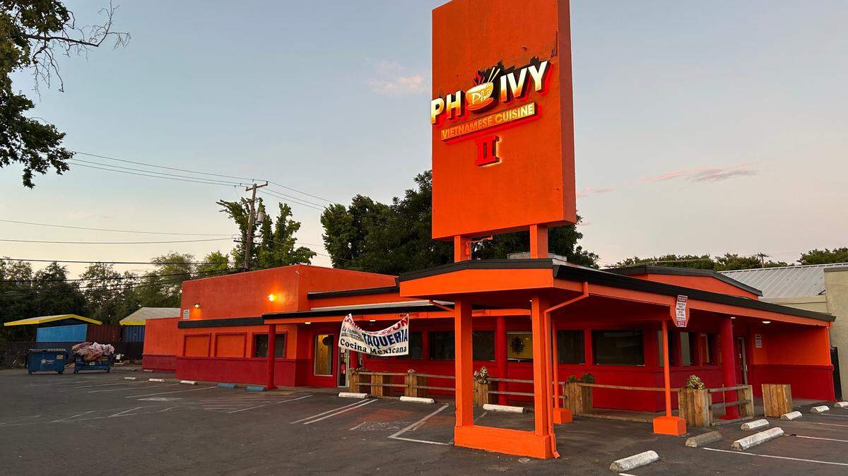 The former storefront of Pho Ivy II at 501 Broadway in Sacramento is painted orange and red on Sunday, July 23, 2023. Los Inmortales Taqueria Cocina Mexicana, a local Mexican restaurant chain, took its spot and is slated to open “soon.”
