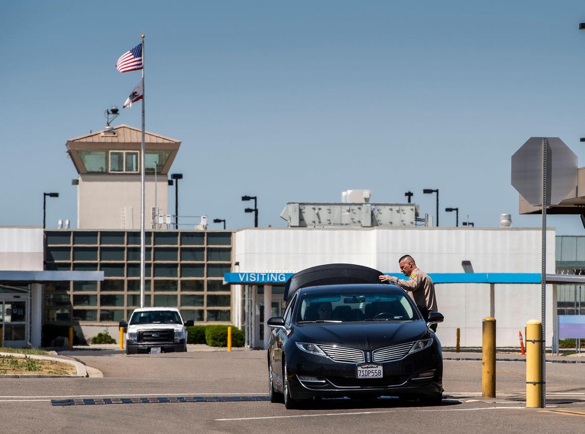 A car is inspected Thursday as it leaves the California Health Care Facility, a prison hospital in south Stockton, that houses about 2,600 inmates. A patient at the prison died from Legionnaires’ disease in 2018. It is has been a common practice among employees at the prison not drink the water.