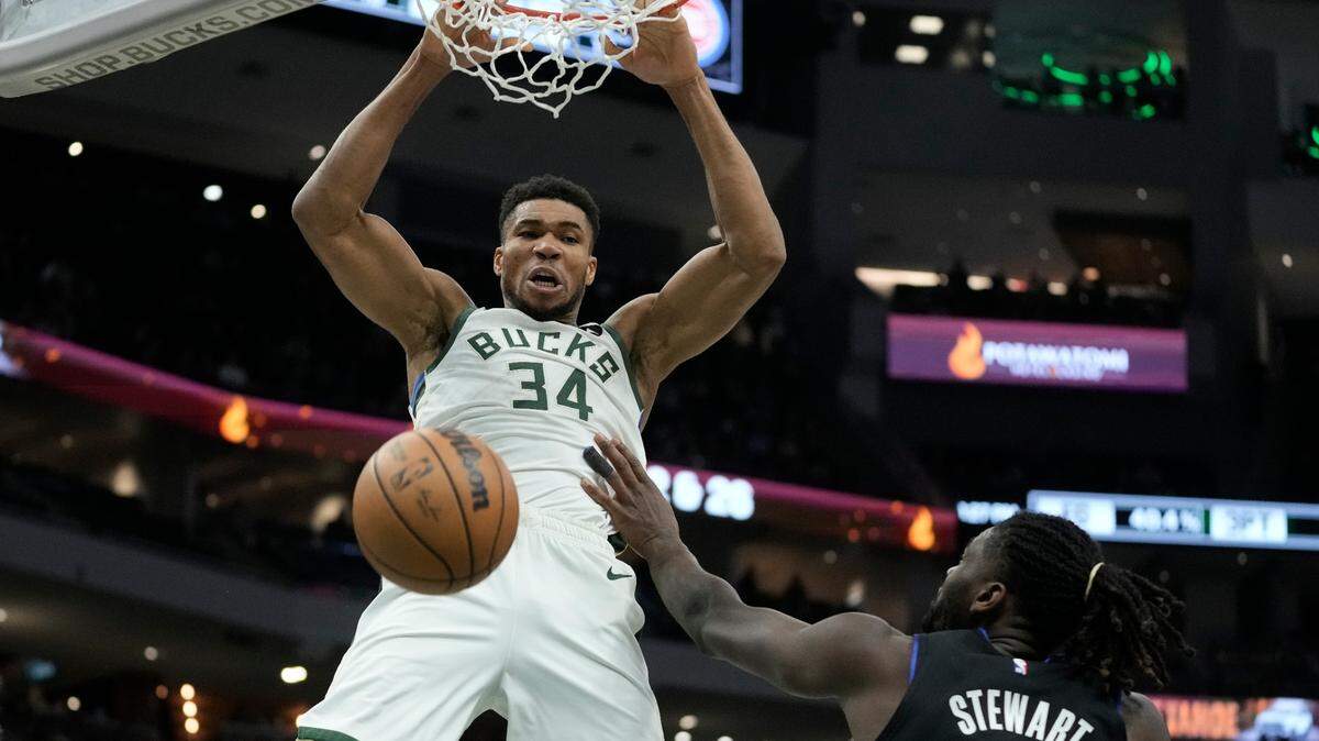 Milwaukee Bucks’ Giannis Antetokounmpo dunks over Detroit Pistons’ Isaiah Stewart during the second half of an NBA basketball game Wednesday, Nov. 2, 2022, in Milwaukee. The Bucks won 116-91. (AP Photo/Morry Gash)