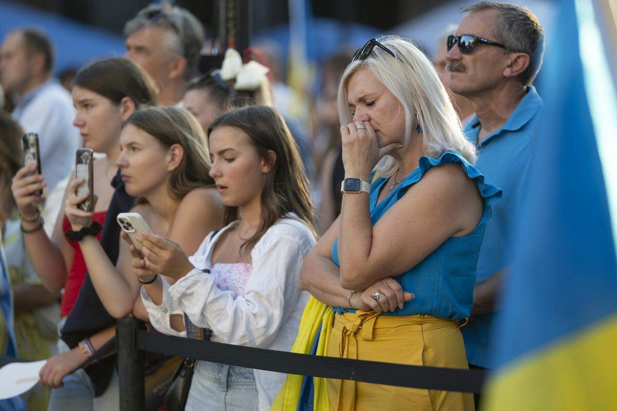 Ukrainian Americans react to a video message from Ukrainian President Volodymyr Zelenskyy during a Ukrainian Independence Day celebration at the California Capitol in Sacramento on Sunday.