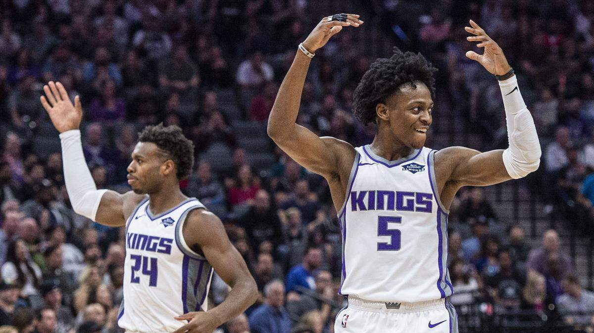 Kings guards De’Aaron Fox (5) and Buddy Hield try to fire up the crowd during a win over the Washington Wizards on Oct. 26 at Golden 1 Center. The Kings are seeing success in the win column so far this season due to improved chemistry.