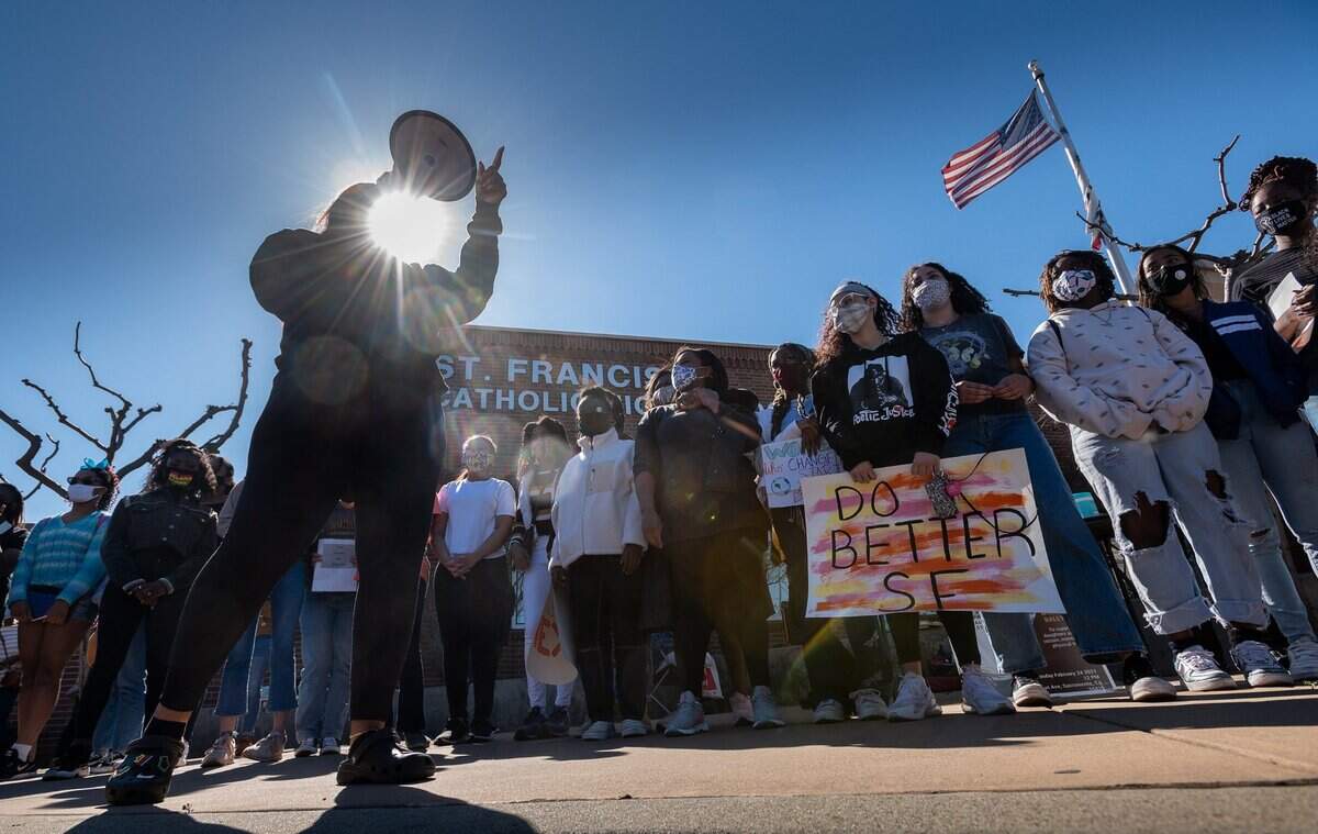 4. Leia Schenk of Empact stands with Black students at St. Francis High School in Sacramento on Wednesday, Feb. 24, 2021, during a press conference after a student was disciplined for allegedly using a Snapchat feature to imitate Blackface and mock a Black peer.