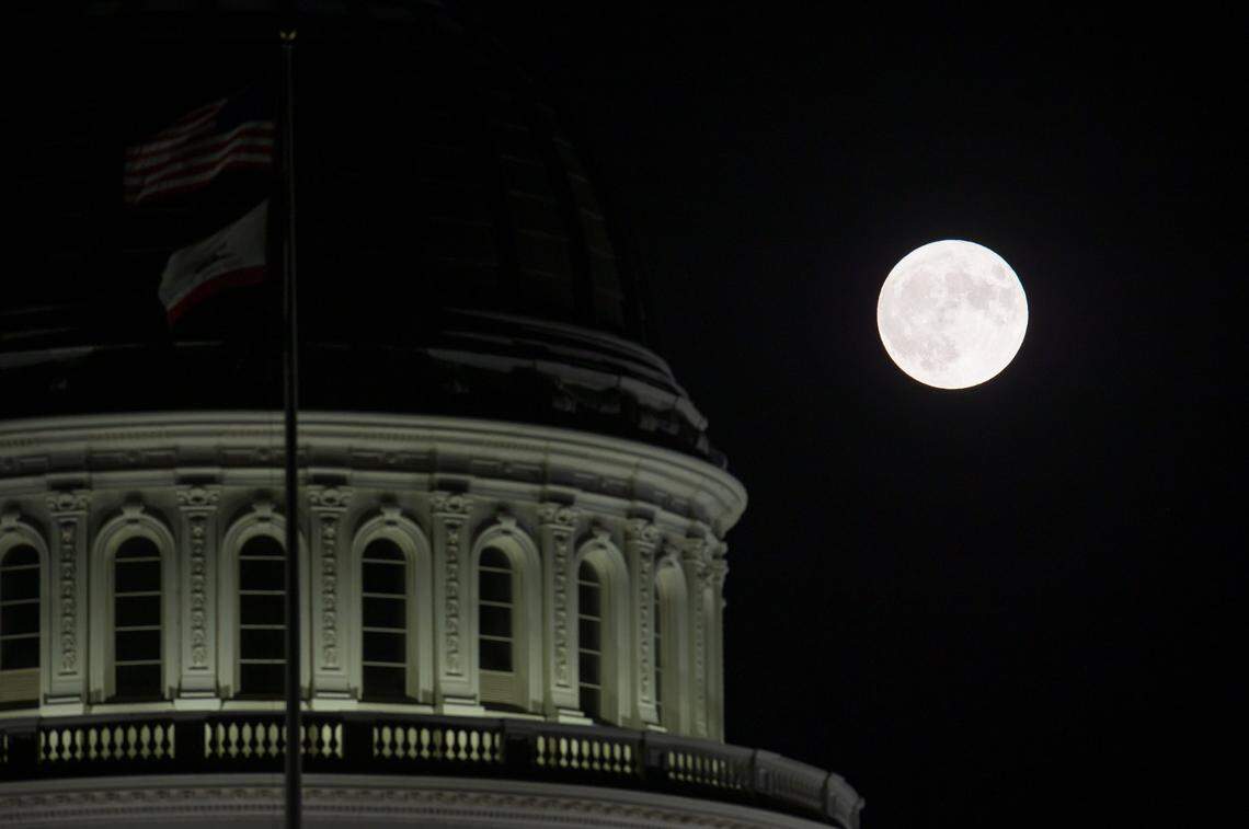 A blue supermoon rises over the capitol in Sacramento Wednesday, Aug. 30, 2023. 
