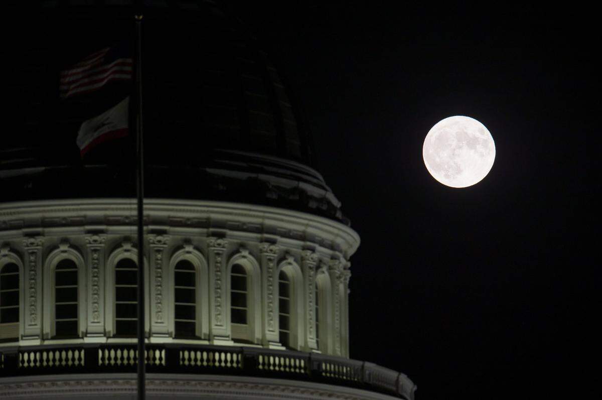 The blue supermoon, which is the closest full moon of the year, rises over the Capitol in Sacramento on Wednesday, Aug. 30, 2023. 
