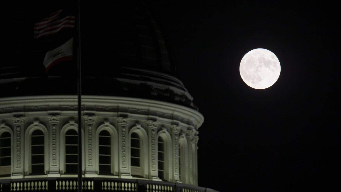 The blue supermoon, which is the closest full moon of the year, rises over the Capitol in Sacramento on Wednesday, Aug. 30, 2023.