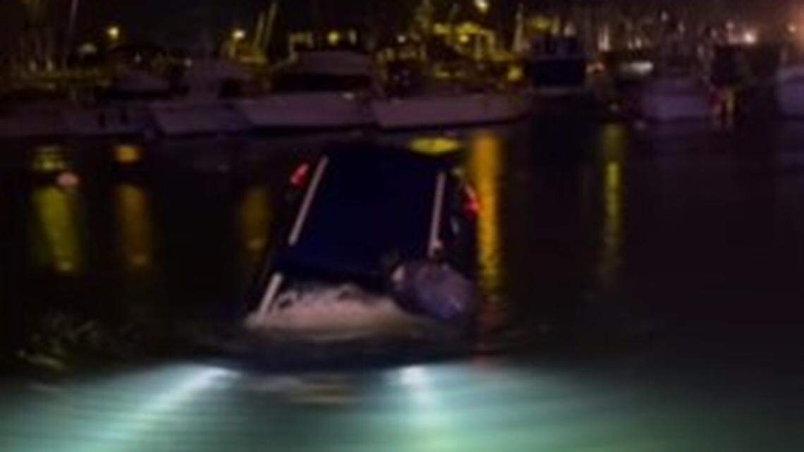 A woman visiting Hawaii drove her vehicle into the ocean while following GPS directions at a harbor, video shows.