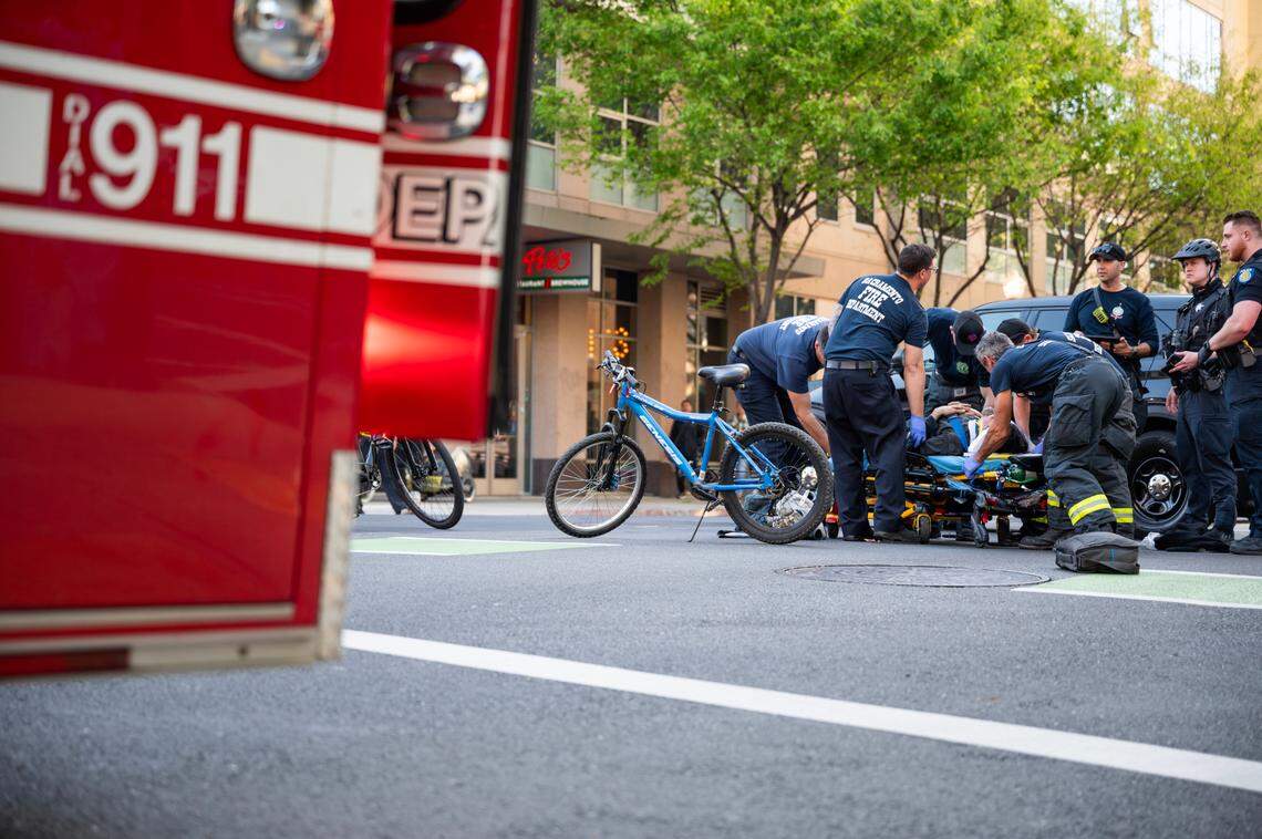 Sacramento firefighters assist a cyclist involved in a nonfatal collision in downtown Sacramento on April 2, 2024.