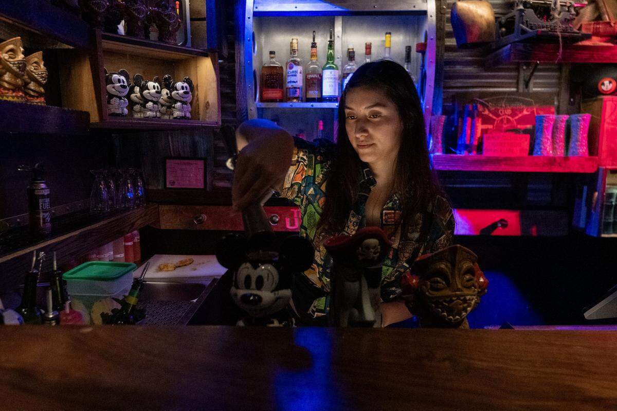 Bartender Rose Juarez makes drinks at Hawthorne’s Hideout, a Tiki-themed underground speakeasy in Old Sacramento, on Thursday.