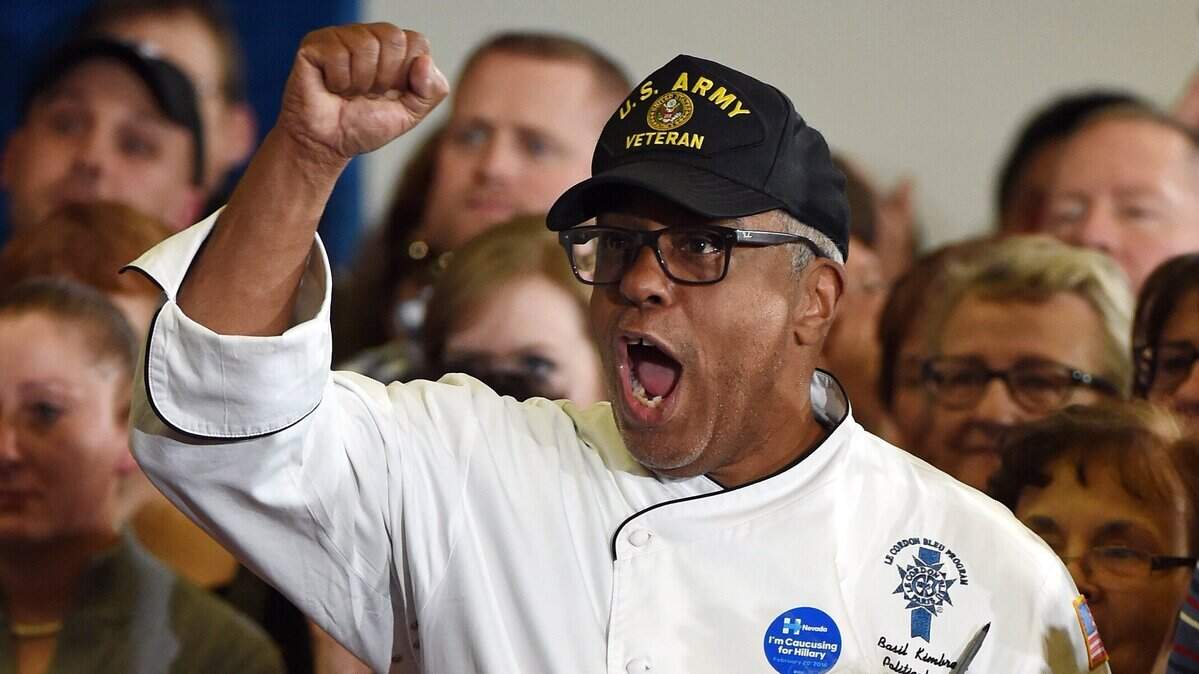 LAS VEGAS, NV - FEBRUARY 14: U.S. Army veteran Basil Kimbrew cheers as Democratic presidential candidate Hillary Clinton speaks at a get-out-the-caucus event at the Mountain Shadows Community Center on February 14, 2016 in Las Vegas, Nevada. Clinton is challenging Sen. Bernie Sanders for the Democratic presidential nomination ahead of Nevada's Feb. 20 Democratic caucus. (Photo by Ethan Miller/Getty Images)