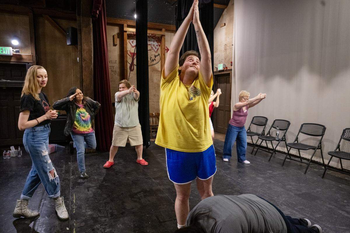 Jessilee Windhaus, left, owner of the improv comedy theater Haus of Comedy, watches her class work through a skit at The Eagle Theatre in Sacramento on Thursday, May 14, 2026.